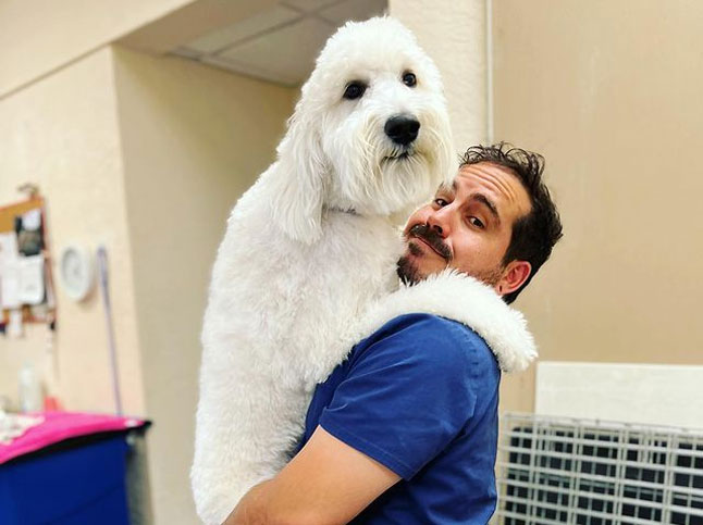 Veterinary team member with a pet during a health exam at Flora Family Vet in Kissimmee
