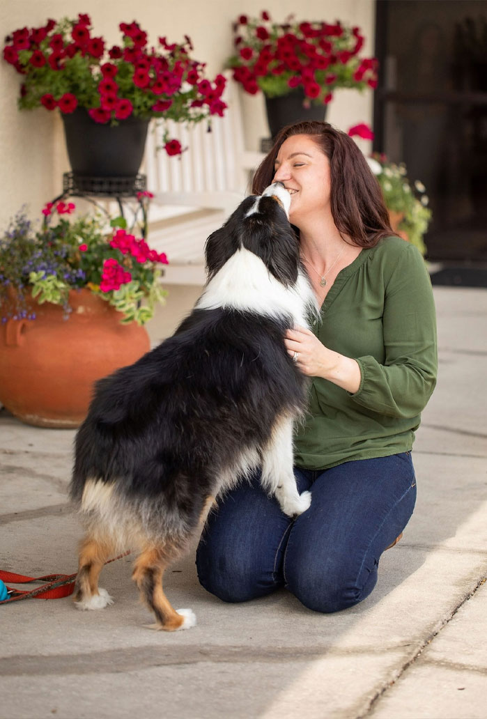 Flora Family Vet team member providing gentle care for a pet patient in Kissimmee FL
